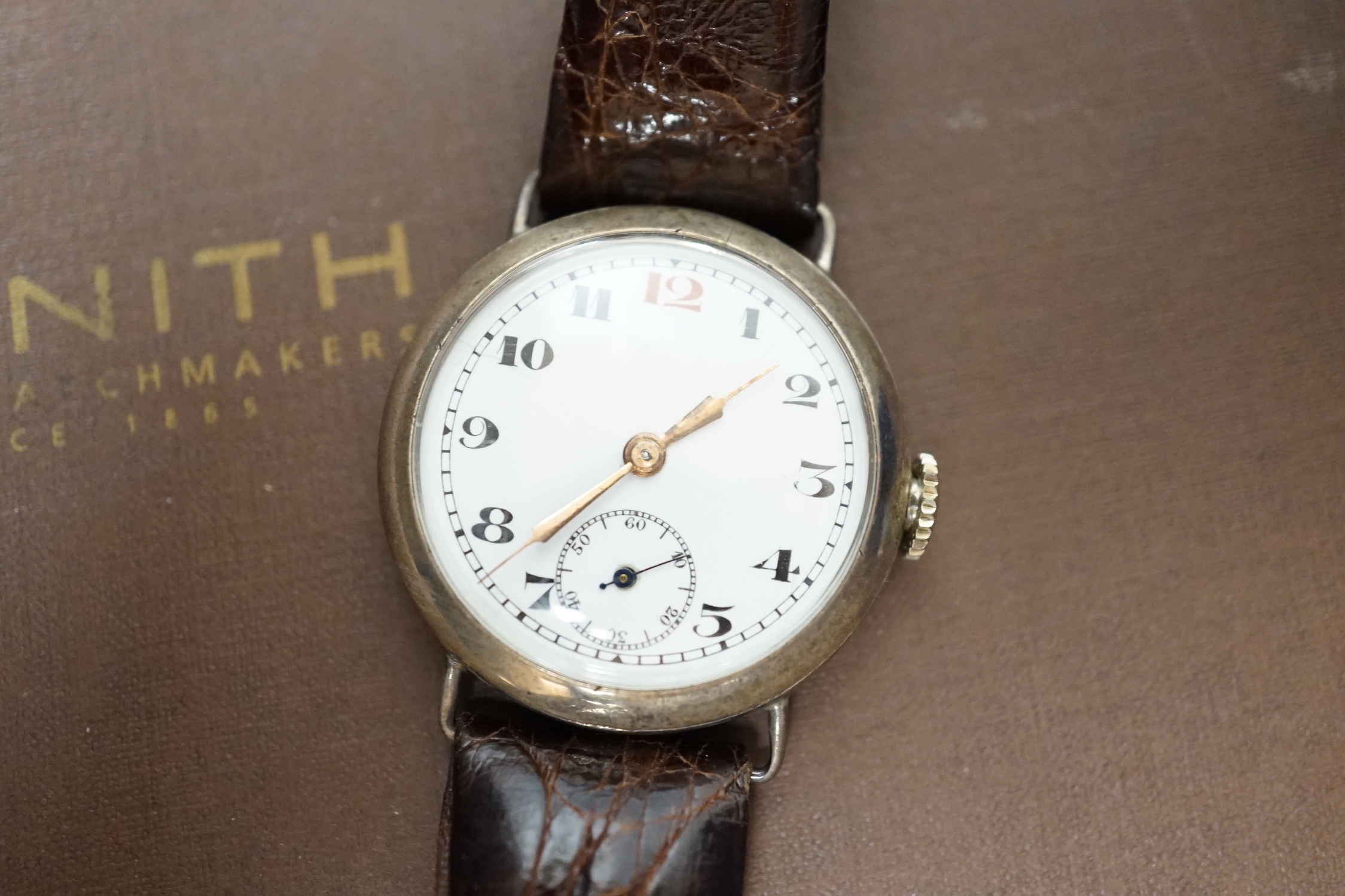 A Rolex watch box, Zenith watch box, Cartier watch box and a gentleman's early 20th century silver manual wind wrist watch.